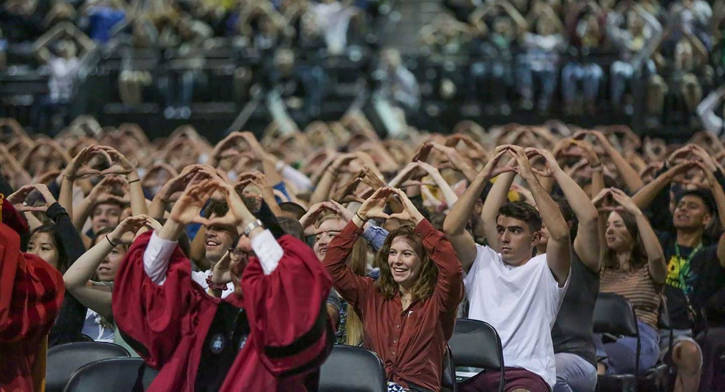 People throwing the O in Matt Knight Arena People throwing the O in Matt Knight Arena